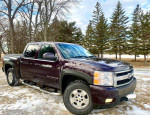 2008 Chevrolet Silverado 1500 LTZ 4WD parked in snowy landscape, showcasing its clean exterior and robust design.