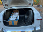 1949 Ford Custom trunk showcasing spare tire and storage box, well-maintained classic sedan with 57,000 miles.
