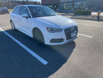 2016 Audi A3 E-Tron in a parking lot, showcasing a clean exterior and modern design.