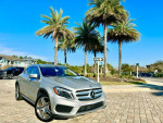 2015 Mercedes-Benz GLA 250 4MATIC SUV parked in a sunny location with palm trees