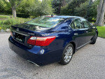 2010 Lexus LS460 AWD in excellent condition parked on a driveway, showcasing its sleek design.