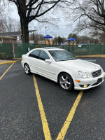 White 2006 Mercedes-Benz C230 parked in a clean lot, well-maintained with no accidents, ready for sale.