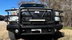 Front view of a 2011 Ford F250 King Ranch FX4 with off-road lights and a steel bumper.