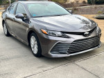 2023 Toyota Camry LE in gray with low mileage, in excellent condition, featuring advanced safety features and sleek design.