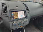 Interior view of a car showcasing the entertainment system with Android Auto and Apple CarPlay features.