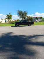 2023 Ford F-350 Super Duty Crew Cab XLT in pristine condition parked on a sunny street