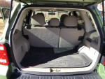 Interior view of the cargo space in a 2010 Ford Escape Limited FWD with weatherproof mats