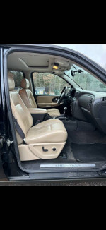 2005 Chevrolet Blazer interior view featuring heated leather seats and modern dashboard controls.