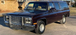1991 GMC Suburban in excellent condition with 61,000 miles, showcasing its classic design and well-maintained exterior.