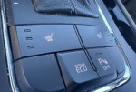 Heated seat controls and Eco mode button in 2016 Kia Sedona LX interior