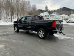 2015 Chevrolet Silverado 1500 LTZ 4WD parked in snowy landscape, showcasing heated leather seats and Z-71 package.