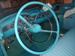 1955 Chevrolet Station Wagon interior featuring blue upholstery and vintage dashboard design