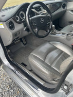 Interior view of a 2006 Mercedes CLS55 with leather seats and modern dashboard features