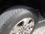 Close-up of Michelin tire on 2014 Ford F150 STX showcasing tread and wheel design