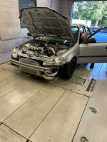 1997 Honda Civic Ferio with K24 turbo setup on a dynamometer testing its performance
