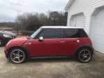 2005 MINI Cooper S in red with aftermarket wheels, parked in a driveway