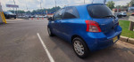 Blue Toyota Yaris hatchback parked, showing clean interior with upgraded features and good tire tread.