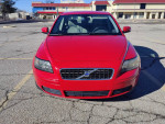 2007 Volvo S40 2.4i sedan in red, showing front view, with 124,000 miles and a clean title.