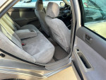 Interior view of a 2004 Toyota Camry showing clean back seats and armrest.