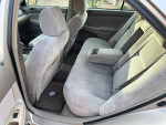 Interior view of a well-maintained 2004 Toyota Camry with clean gray upholstery.