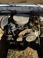 Engine view of a 1978 Ford F250 with new brakes, showing a vintage truck in need of repairs and maintenance.