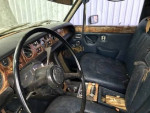 Interior of a 1972 Rolls-Royce Silver Shadow limousine with dual moon roofs and luxurious features