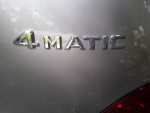 Close-up of the 4MATIC branding on a 2010 Mercedes-Benz R 350, showcasing all-wheel drive capability.