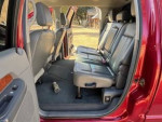 Interior of a 2006 Dodge Ram 2500 mega cab with leather seats and spacious back row.