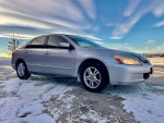 2005 Honda Accord LX Sedan with clean title for sale, 95,000 miles, reliable, good condition, parked on snowy ground.