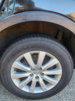 Close-up of a Mazda wheel with a new tire, showcasing the vehicle's good condition and mechanical reliability.