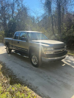 2001 Chevrolet Silverado 2500 4x4 truck with 147k miles, clean title, parked on a dirt road.