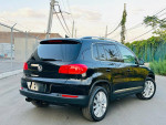 2012 Volkswagen Tiguan SE 4Motion AWD in black, showcasing alloy wheels and clean exterior