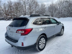 2016 Subaru Outback 2.5i Premium AWD, very clean, parked in snow, showcasing its design and features.