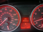 Speedometer and dashboard of a 2011 BMW 328I showing 95,937 miles and time.