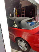 1994 Mustang GT convertible parked in a garage, showcasing its vintage design and low mileage features.