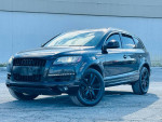 2013 Audi Q7 3.0T Premium Plus quattro in black with sleek design and modern features parked outdoors.
