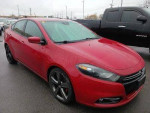 2014 Dodge Dart GT in red, featuring manual transmission and stylish design with alloy wheels.