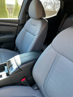 Interior view of 2022 Hyundai Santa Cruz SEL showcasing light gray seats and center console.