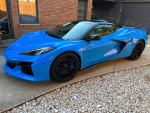 2023 Chevrolet Corvette Z06 Convertible in Rapid Blue with Jet Black interior parked on a driveway