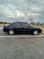 2006 Chevrolet Malibu LT in blue parked, showing low mileage and clean condition, suitable for buyers.