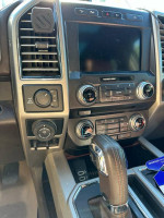 Interior dashboard of a 2018 Ford F-150 King Ranch with modern controls and infotainment system.
