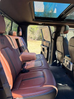 Interior of a 2018 Ford F-150 King Ranch with brown leather seats and double panoramic sunroof