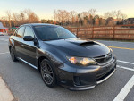 2014 Subaru Impreza WRX Sedan in great condition, featuring a turbo engine and manual transmission with low mileage.