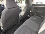 Interior view of a 2007 Volkswagen Jetta, featuring black cloth seats and spacious back cabin.