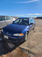 1995 Honda Civic DX with 97k miles, clean title, and original parts parked on a sunny day.