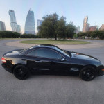 2008 Mercedes-Benz SL 550 in black with low mileage parked in an urban setting