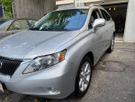 2012 Lexus RX 350 FWD in silver, showcasing its sleek design and well-maintained exterior.