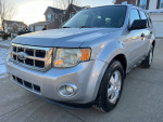 2012 Ford Escape XLT FWD, silver color, clean exterior, parked on driveway with snow, showing front view