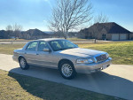 2008 Mercury Grand Marquis LS in silver with low mileage parked on a driveway
