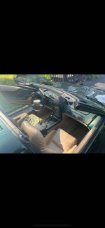 Interior view of a well-maintained 1994 Chevrolet Corvette with 76,000 miles, featuring leather seats and dashboard.